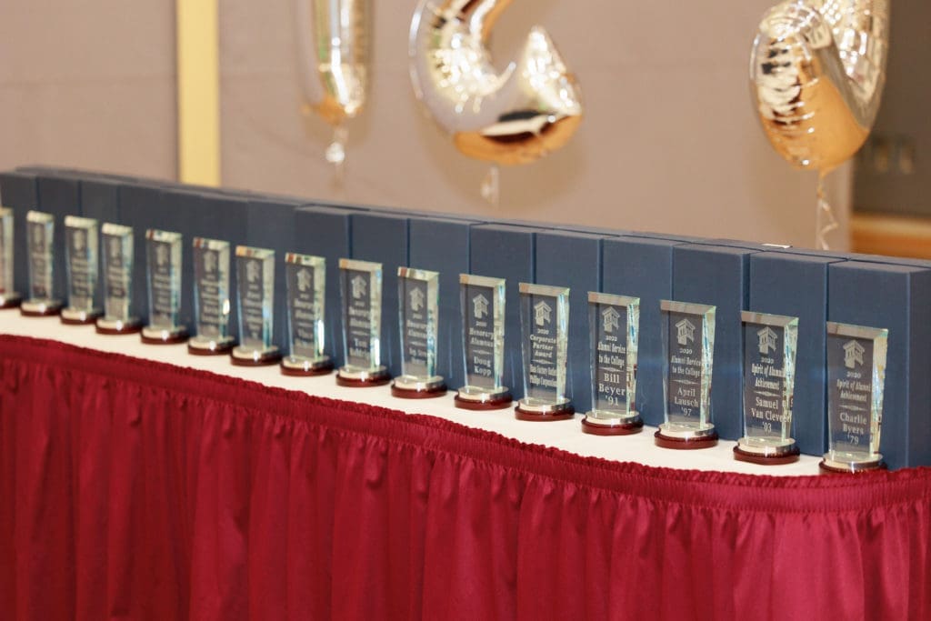Alumni awards laid out on a table. 