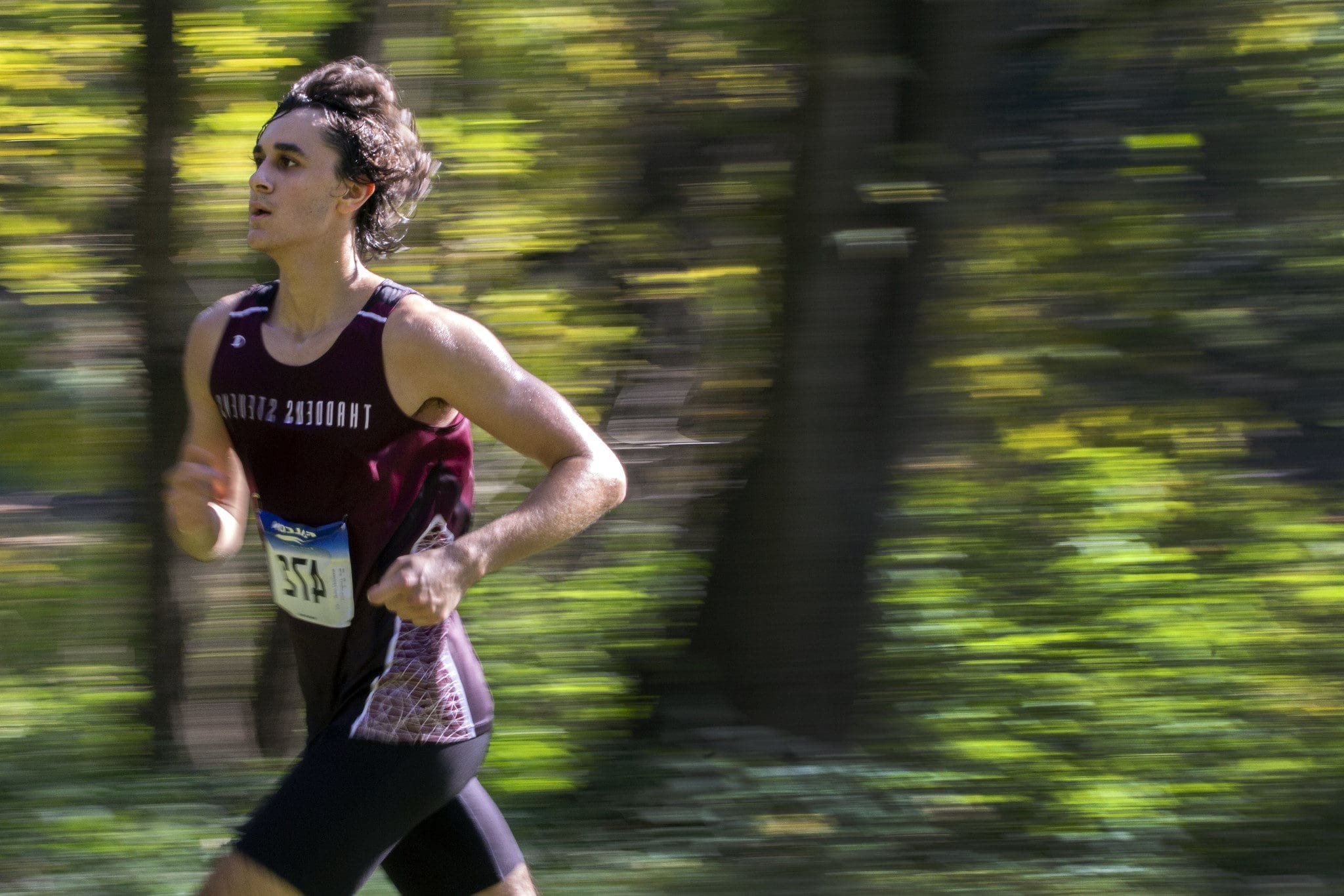 A student on the Cross Country team at Thaddeus Stevens College running at a competition. 