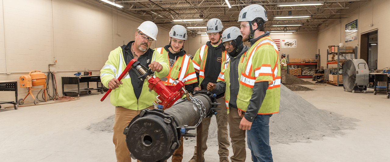 Mitch Kauffman, instructor, showcases important pipe work to Civil Engineering Construction Technology students. 