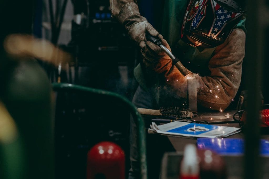 A welder hard at work with metals.