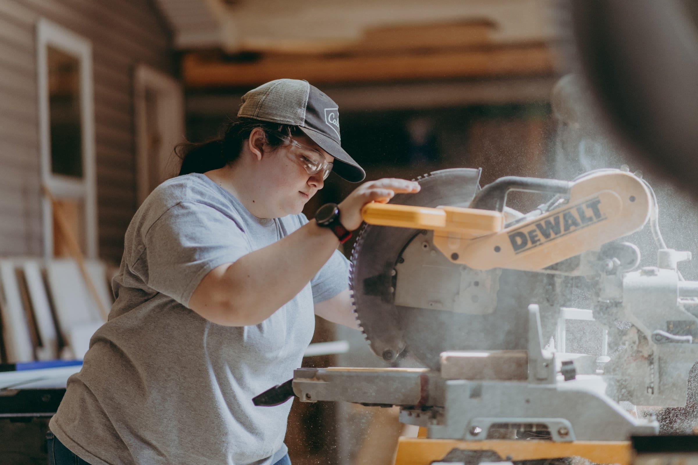 A carpentry student working with a saw in the shop at Thaddeus Stevens college of Technology.