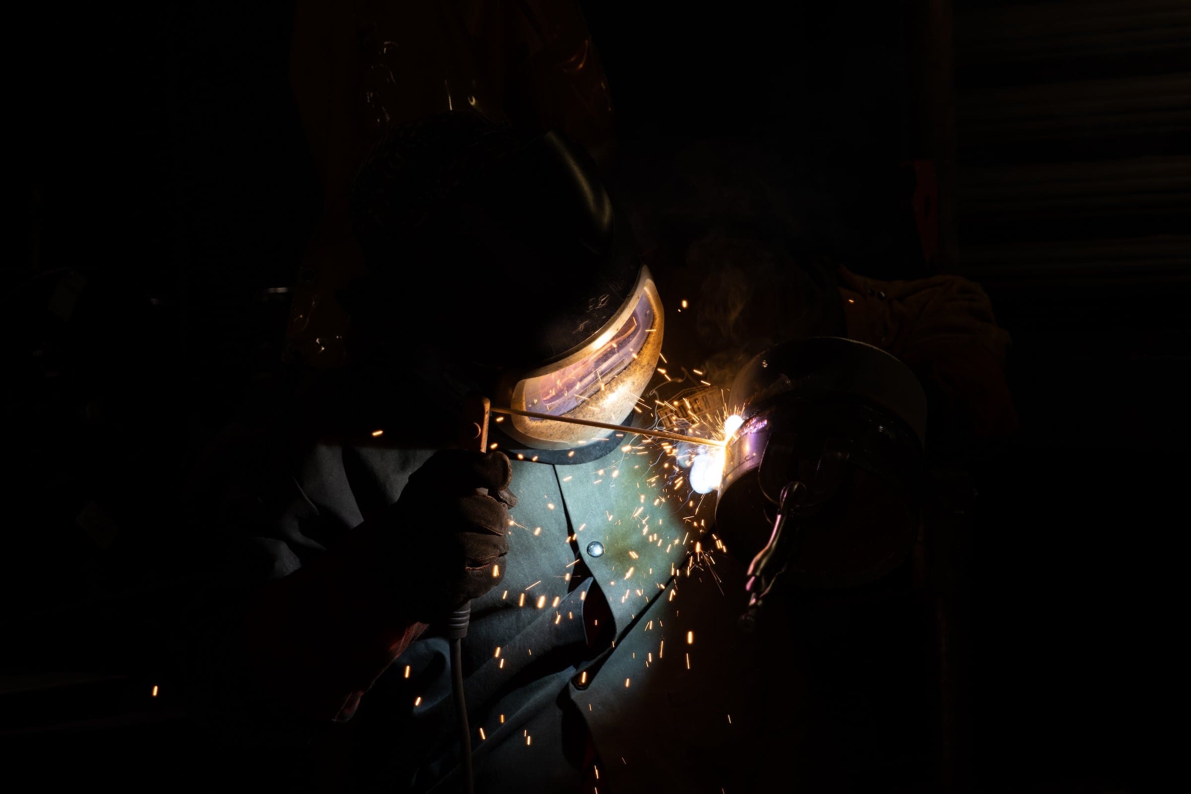 A student practicing welding technology. 