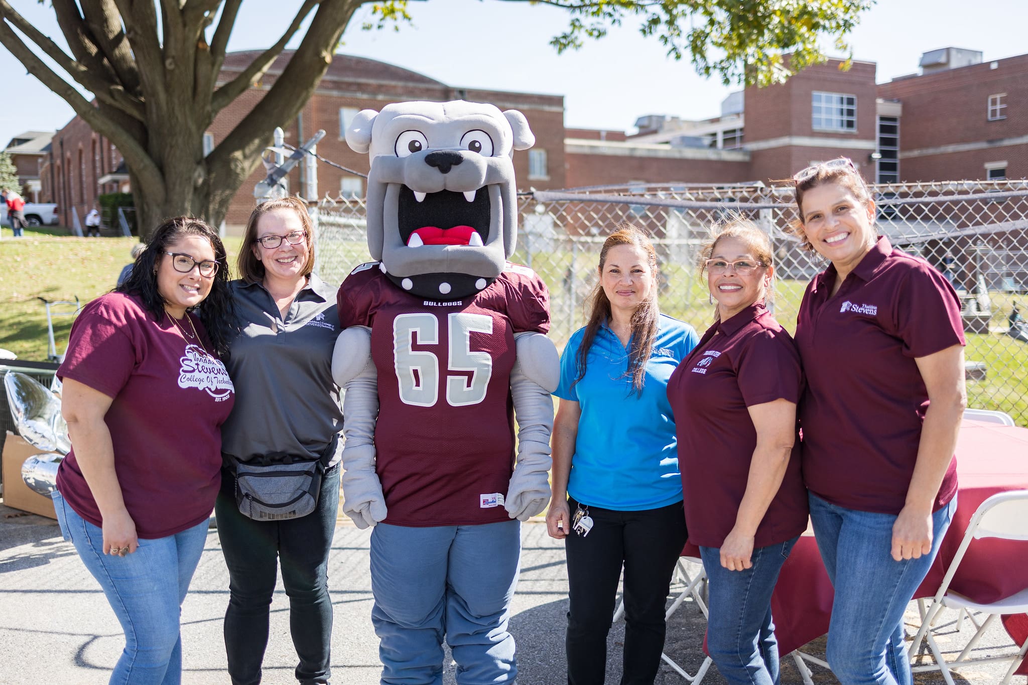 Champ and several staff at a College event