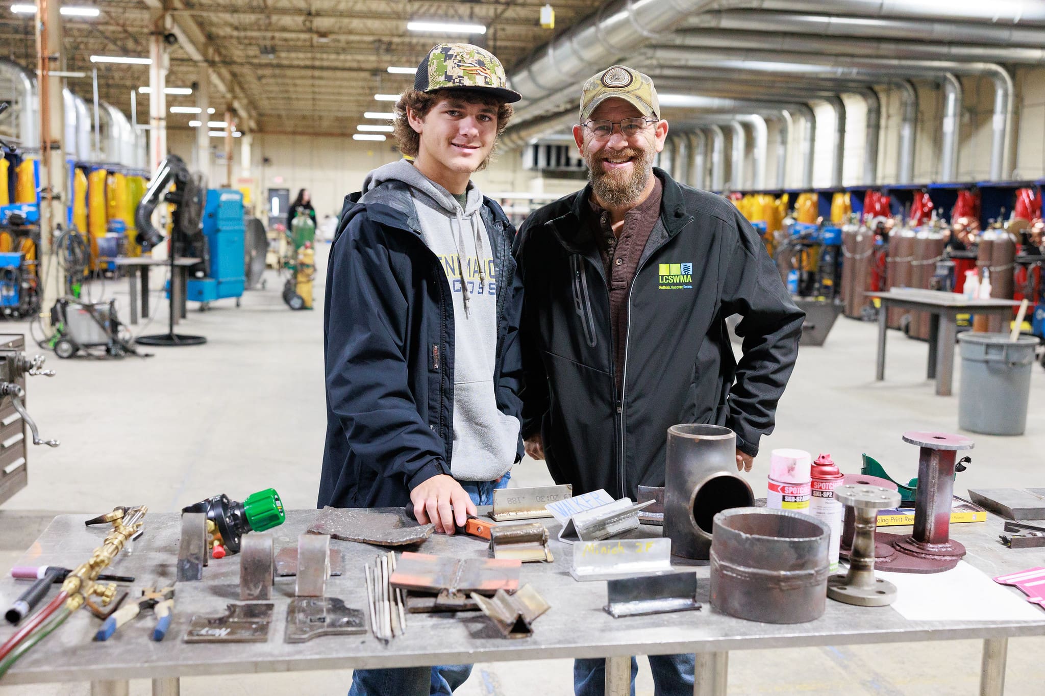 A parent and son at the civil engineering construction lab at Thaddeus Stevens College. 