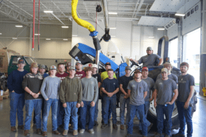 Solanco + Elco High School with Thaddeus Stevens College of Technology Diesel Technology Students pictured with Tractor